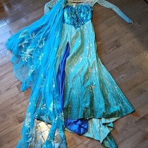 Elegant Blue and Green Gown with Floral Details